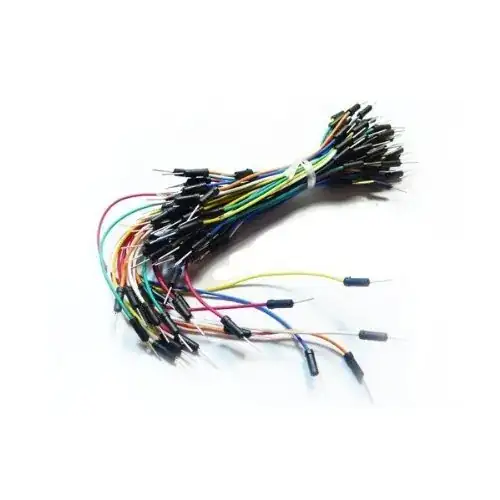 A blue PCB with a number of components soldered on, including three silver wires.