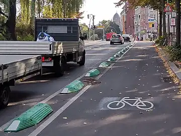 bumpseparation_kerb, lane_separator – small bumps/guide curbs/separation kerbs/armadillos mounted on the ground to make it more difficult for vehicles to pass over.
