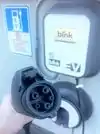 EV charging station with SAE J1772 connector at an office park in San Diego, California