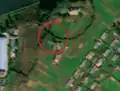 3/6 Communication tower (man_made=tower and tower:type=communication), with an antenna casting a shadow and a small building, in a valley (Maxar satellite imagery).