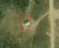 6/6 Communication tower (man_made=tower and tower:type=communication), with an antenna and a small building, on top of a mountain (Maxar satellite imagery).
