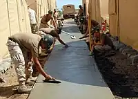 Cement based concrete, forming a large surface, typically cast in placesurface=concrete