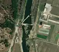 2/6 Dam (waterway=dam) in the middle of a watercourse (Maxar satellite imagery).