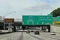 A guide sign with one arrow per lane or a diagrammatic sign that depicts each lane