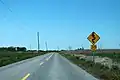 Another example of warning signage that is not appropriate for the turn:lanes tag.