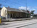 The same line, but outside the city following rules of a "normal" train with stations, level crossings, …