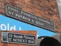 St. Patrick's Quay in Cork. Different spelling (of the irish name) on two edges of the same building.