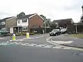 Give way markings without an upright sign are commonly used on minor road junctions in the UK and the node could be additionally be tagged with traffic_sign=GB:1003A
