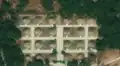 1/8 Orderly cemetery (landuse=cemetery), characterised by regular mounds with straight paths (Maxar satellite imagery).