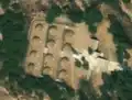 2/8 Orderly cemetery (landuse=cemetery), characterized by regular mounds with straight paths ([Maxar satellite imagery]).