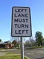 Some other kind of regulatory sign that refers to a turn