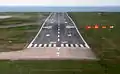 The PAPI can be seen to the right of the runway. The plane is below the glideslope.