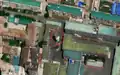 3/4 Storage tank (man_made=storage_tank) in a highly urbanised centre with a mural (artwork_type=mural and tourism=artwork) and a monument (historic=memorial) (Maxar satellite imagery).