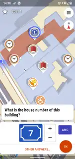 eine 3D-Karte, die eine Hausnummern-Frage "What is the house number of this building?" am unteren Rand zeigt